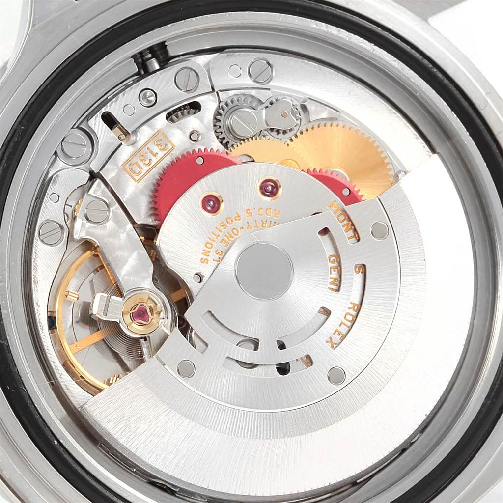 This image shows the intricate internal movement of the Rolex Submariner 14060 Men's Stainless Steel Black Dial 14060 Men's Stainless Steel Black Dial watch from a close-up angle.