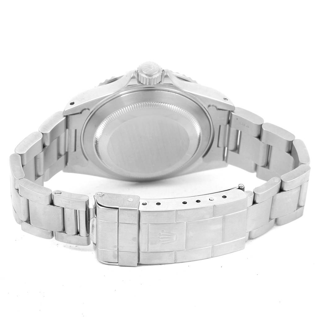 This image shows the back case and folded-down clasp of a Rolex Submariner 14060 Men's Stainless Steel Black Dial 14060 Men's Stainless Steel Black Dial watch from a rear angle.