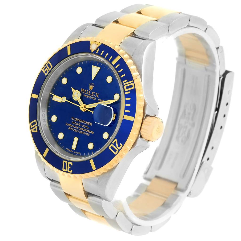 The image shows a Rolex Submariner 16613 Men
s Steel and Gold (two tone) Blue Dial 16613 Men
s Steel and Gold (two tone) Blue Dial watch angled from the left, displaying the dial, bezel, and part of the bracelet.