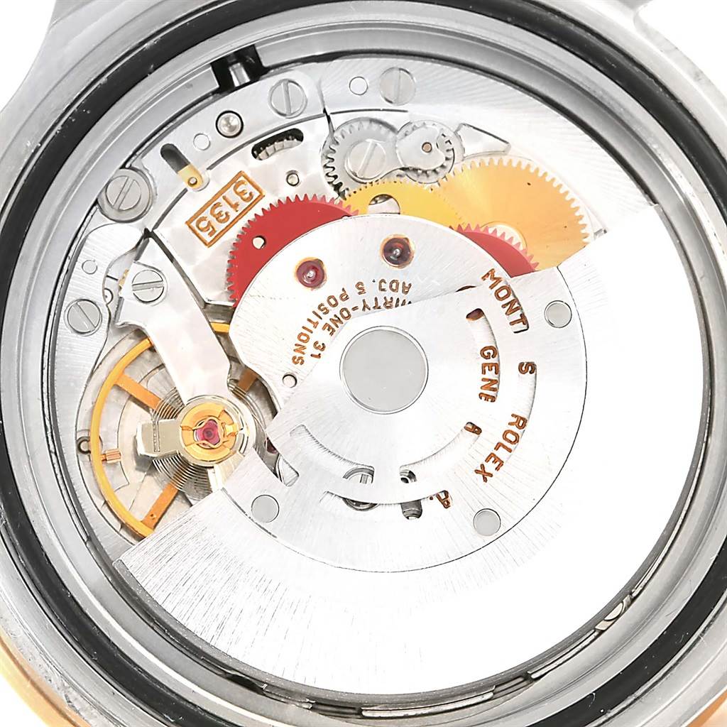 This image shows the internal mechanism and movement of a Rolex Submariner 16613 Men
s Steel and Gold (two tone) Blue Dial 16613 Men
s Steel and Gold (two tone) Blue Dial watch from a back angle.