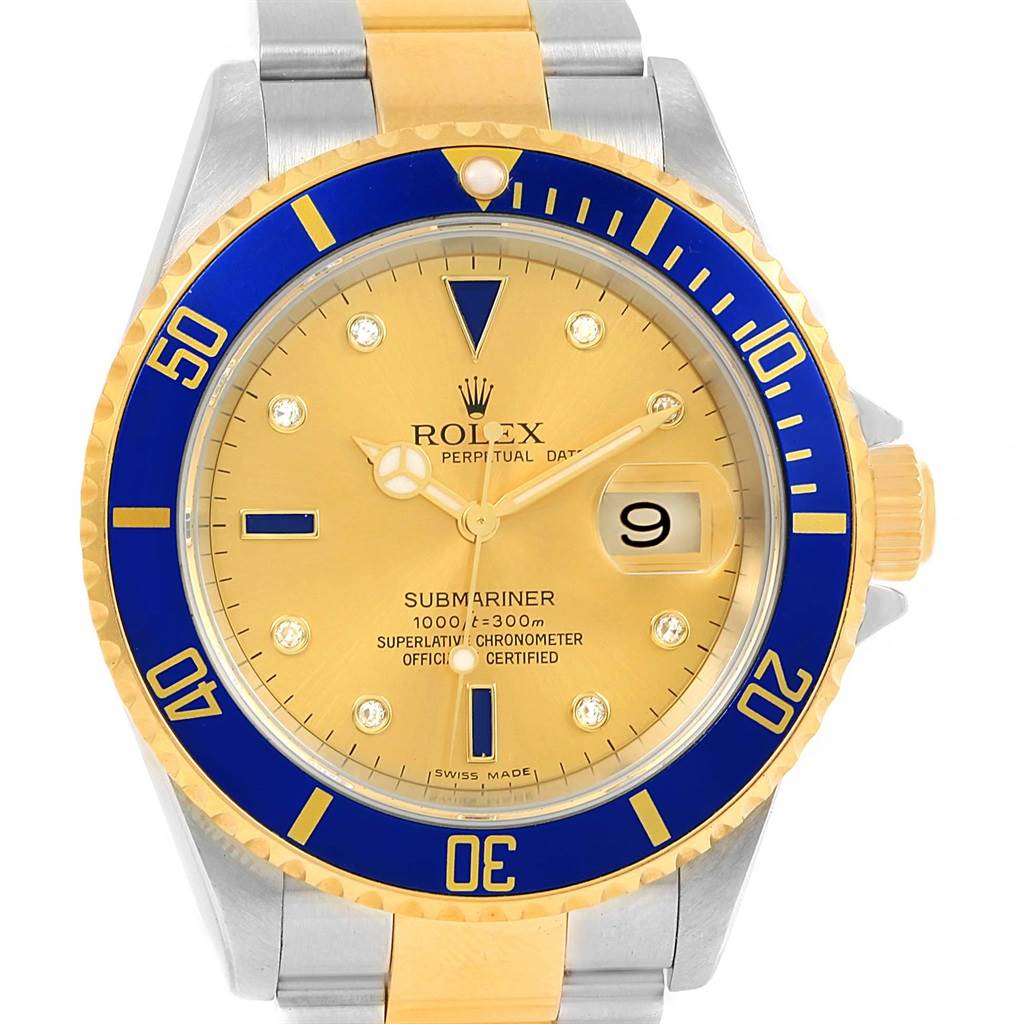 The Rolex Submariner 16613 Men
s Steel and Gold (two tone) Champagne Dial 16613 Men
s Steel and Gold (two tone) Champagne Dial watch is shown from a front angle, highlighting its gold and blue bezel, dial, and two-tone bracelet.