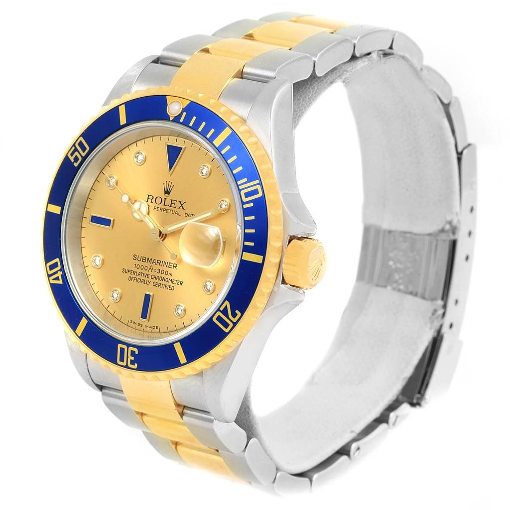 The Rolex Submariner 16613 Men
s Steel and Gold (two tone) Champagne Dial 16613 Men
s Steel and Gold (two tone) Champagne Dial watch is shown from a three-quarter angle, highlighting its face, bezel, and bracelet.