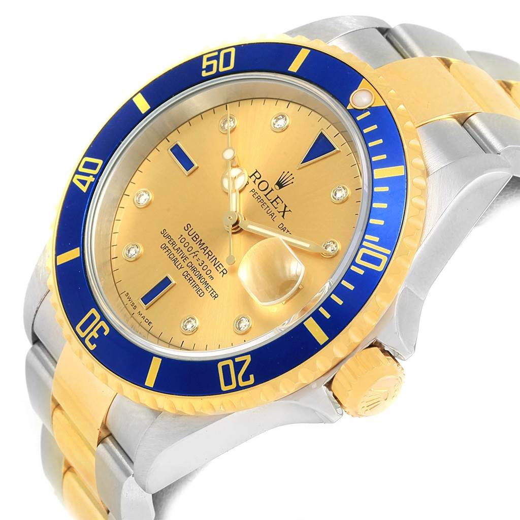 This Rolex Submariner 16613 Men
s Steel and Gold (two tone) Champagne Dial 16613 Men
s Steel and Gold (two tone) Champagne Dial is shown from an angled top-down view, displaying the bezel, dial, crown, and part of the bracelet.