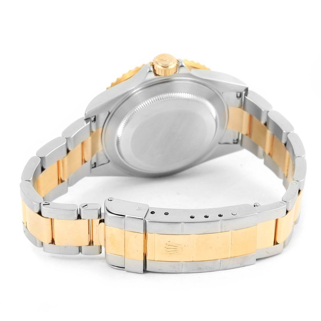 The image shows the back view of the Rolex Submariner 16613 Men
s Steel and Gold (two tone) Champagne Dial 16613 Men
s Steel and Gold (two tone) Champagne Dial, highlighting the bracelet, clasp, and case back.