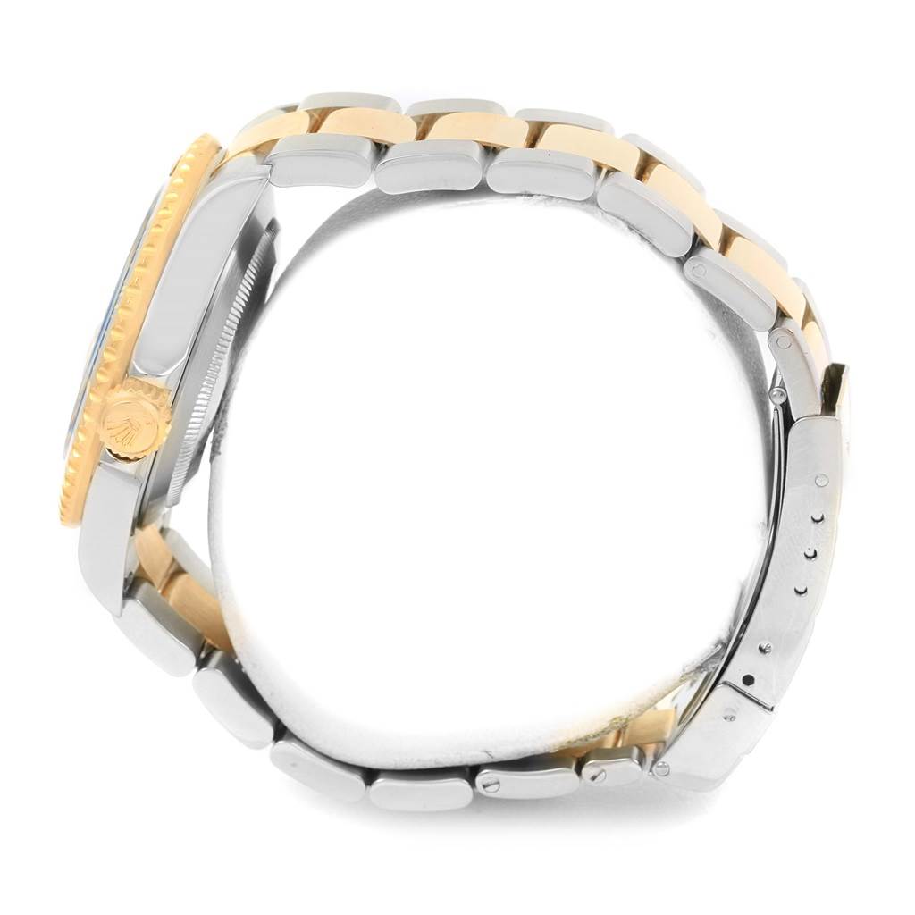 This side view of the Rolex Submariner 16613 Men
s Steel and Gold (two tone) Champagne Dial 16613 Men
s Steel and Gold (two tone) Champagne Dial shows the watch
s case, crown, and bracelet.