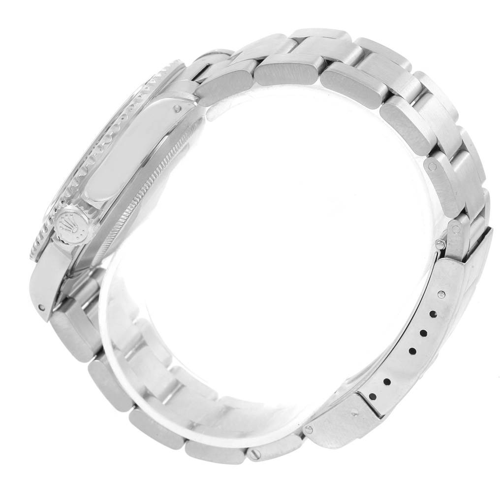 This image shows the side view of a Rolex Submariner 14060 Men
s Stainless Steel Black Dial 14060 Men
s Stainless Steel Black Dial, highlighting the band, clasp, and part of the case with the crown.