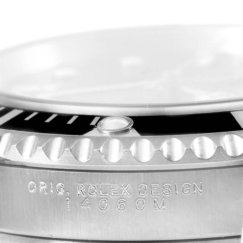 The image shows a close-up of the side of the bezel and casing of a Rolex Submariner 14060 Men's Stainless Steel Black Dial 14060 Men's Stainless Steel Black Dial, displaying the model engraving.
