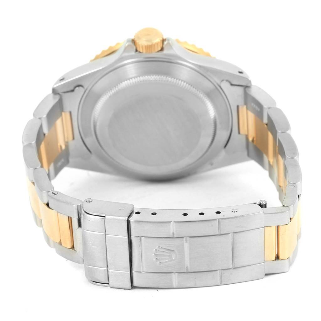 The image shows the back case and bracelet of a Rolex Submariner 16613 Men
s Steel and Gold (two tone) Black Dial 16613 Men
s Steel and Gold (two tone) Black Dial watch, with its clasp and crown visible.