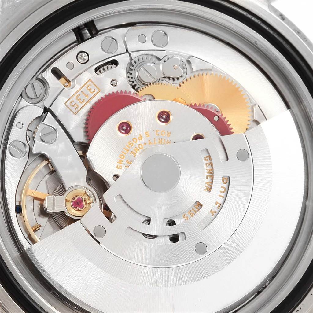 The image shows a close-up of the internal mechanical movement of a Rolex Submariner 16610 Men's Stainless Steel Black Dial 16610 Men's Stainless Steel Black Dial watch.