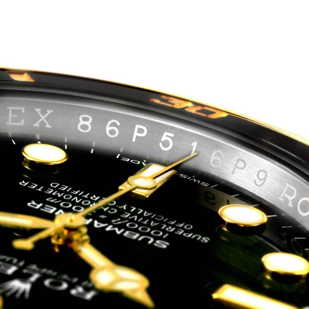 This close-up angle shows the dial, hands, and part of the bezel of the Rolex Submariner 116613 Men
s Steel and Gold (two tone) Black Dial 116613 Men
s Steel and Gold (two tone) Black Dial, highlighting the text and markers.
