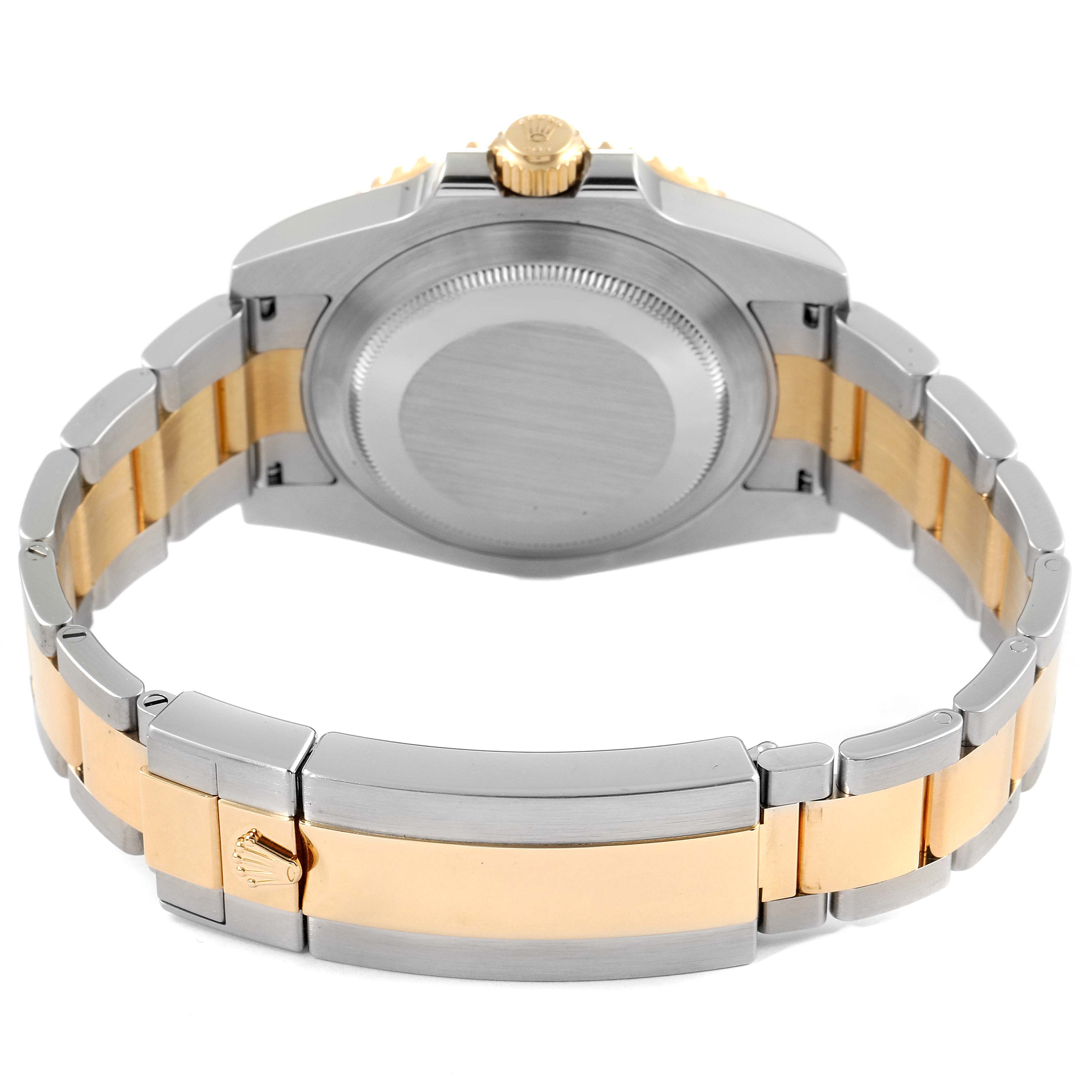 The image shows the back view of a Rolex Submariner 116613 Men's Steel and Gold (two tone) Blue Dial 116613 Men's Steel and Gold (two tone) Blue Dial watch, highlighting the case back and two-tone bracelet.