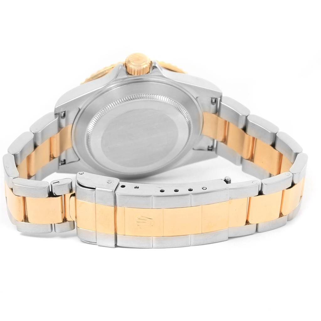 The image shows the back view of the Rolex Submariner 16613 Men's Steel and Gold (two tone) Blue Dial 16613 Men's Steel and Gold (two tone) Blue Dial watch, highlighting the case back, crown, and two-tone bracelet with clasp.