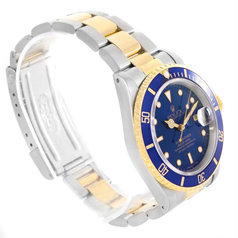 This image shows a side and angled front view of a Rolex Submariner 16613 Men
s Steel and Gold (two tone) Black Dial 16613 Men
s Steel and Gold (two tone) Black Dial watch with a blue dial, blue bezel, and two-tone metal band.