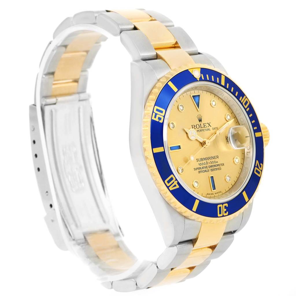 The image shows a Rolex Submariner 16613 Men's Steel and Gold (two tone) Champagne Dial 16613 Men's Steel and Gold (two tone) Champagne Dial watch, including its full bracelet, blue bezel, gold-tone dial, and side profile.
