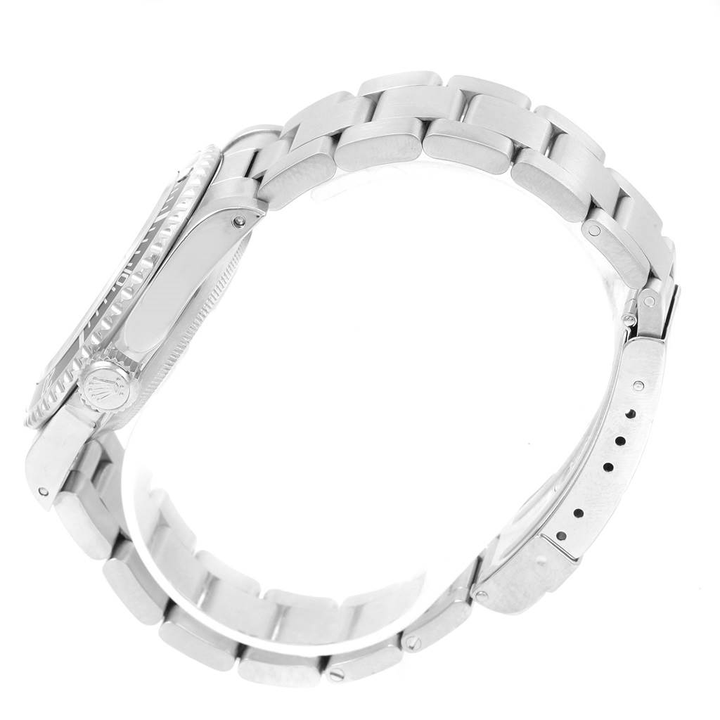 This image shows a side view of the Rolex Submariner 14060 Men's Stainless Steel Black Dial 14060 Men's Stainless Steel Black Dial watch, focusing on the case, crown, and bracelet.