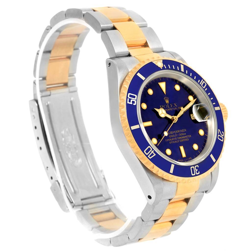 The image shows a side angle of a Rolex Submariner 16613 Men's Steel and Gold (two tone) Blue Dial 16613 Men's Steel and Gold (two tone) Blue Dial watch, featuring the band, bezel, and dial.
