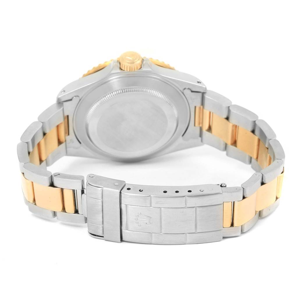 The image shows the back of the Rolex Submariner 16613 Men's Steel and Gold (two tone) Blue Dial 16613 Men's Steel and Gold (two tone) Blue Dial watch, focusing on the bracelet and the clasp.