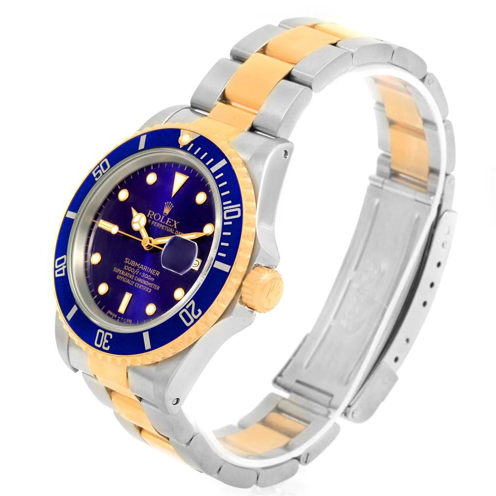 The image shows a Rolex Submariner 16613 Men's Steel and Gold (two tone) Blue Dial 16613 Men's Steel and Gold (two tone) Blue Dial watch at a three-quarter angle, displaying the face, bezel, crown, case, and two-tone bracelet.