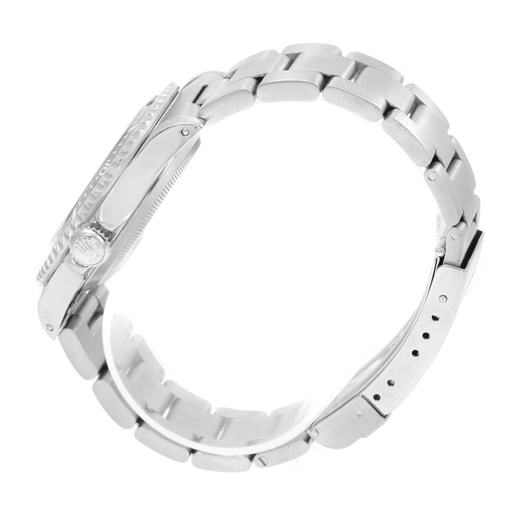 The image shows a side profile of a Rolex Submariner 14060 Men's Stainless Steel Black Dial 14060 Men's Stainless Steel Black Dial watch, highlighting the bracelet and crown.