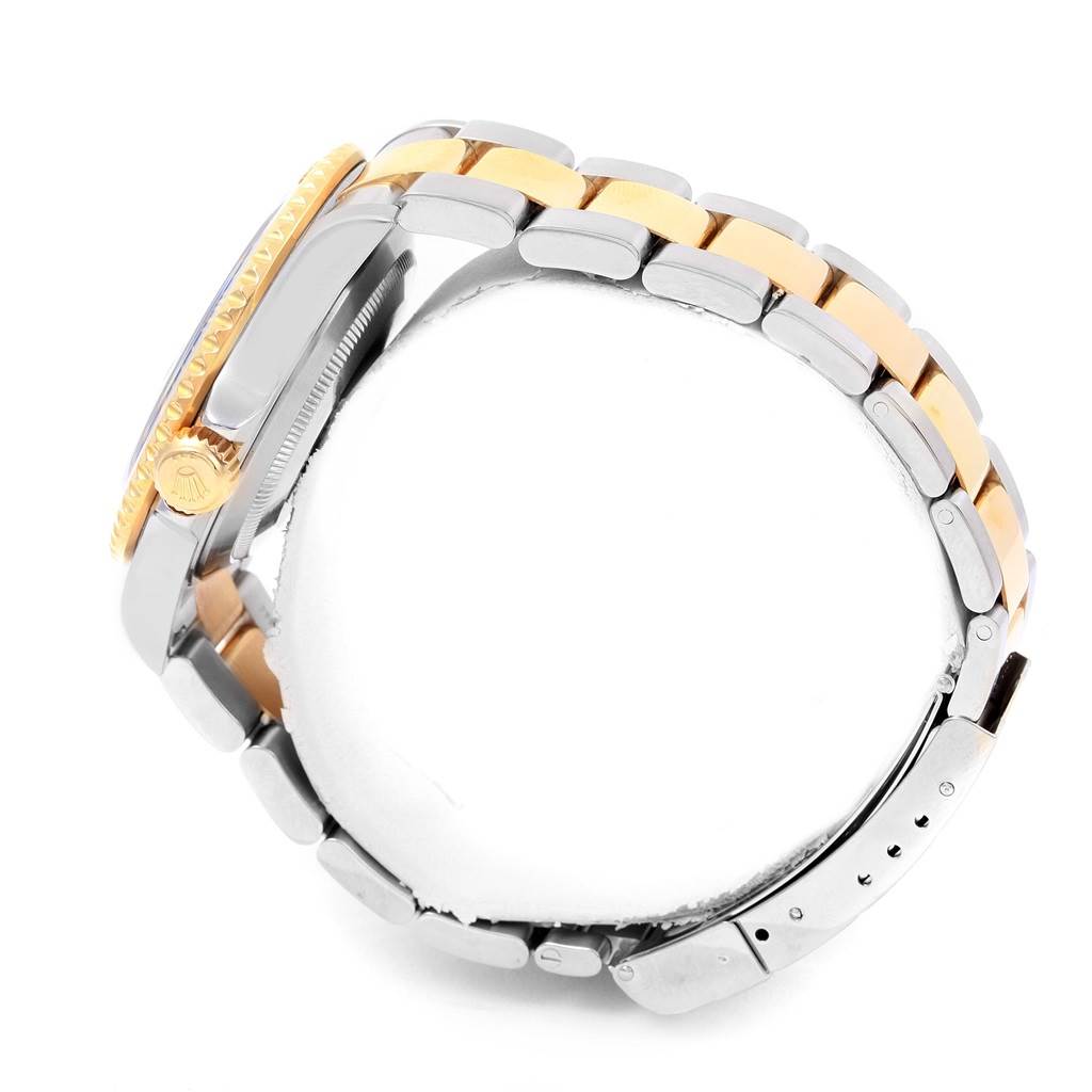 The image shows a side view of a Rolex Submariner 16613 Men's Steel and Gold (two tone) Blue Dial 16613 Men's Steel and Gold (two tone) Blue Dial watch, highlighting the bracelet, crown, and case.