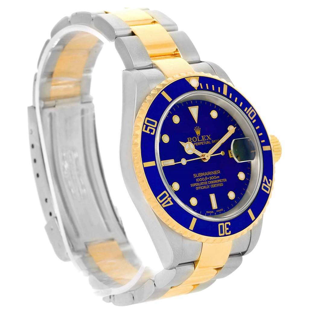 This Rolex Submariner 16613 Men's Steel and Gold (two tone) Blue Dial 16613 Men's Steel and Gold (two tone) Blue Dial watch is shown at a slight angle, highlighting the blue dial, bezel, and two-tone gold and silver bracelet.