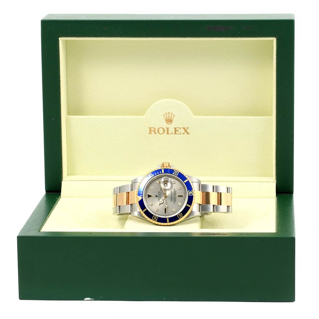The Rolex Submariner 16613 Men
s Steel and Gold (two tone) Grey Dial 16613 Men
s Steel and Gold (two tone) Grey Dial watch is displayed front-facing in an open Rolex box.