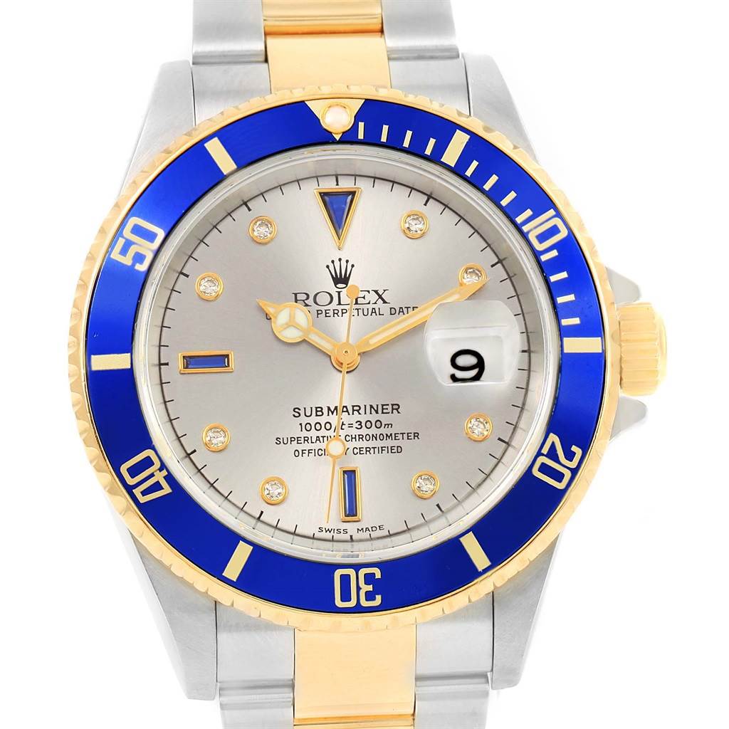 The image shows a front view of the Rolex Submariner 16613 Men
s Steel and Gold (two tone) Grey Dial 16613 Men
s Steel and Gold (two tone) Grey Dial watch, highlighting the bezel, dial, hands, and part of the bracelet.