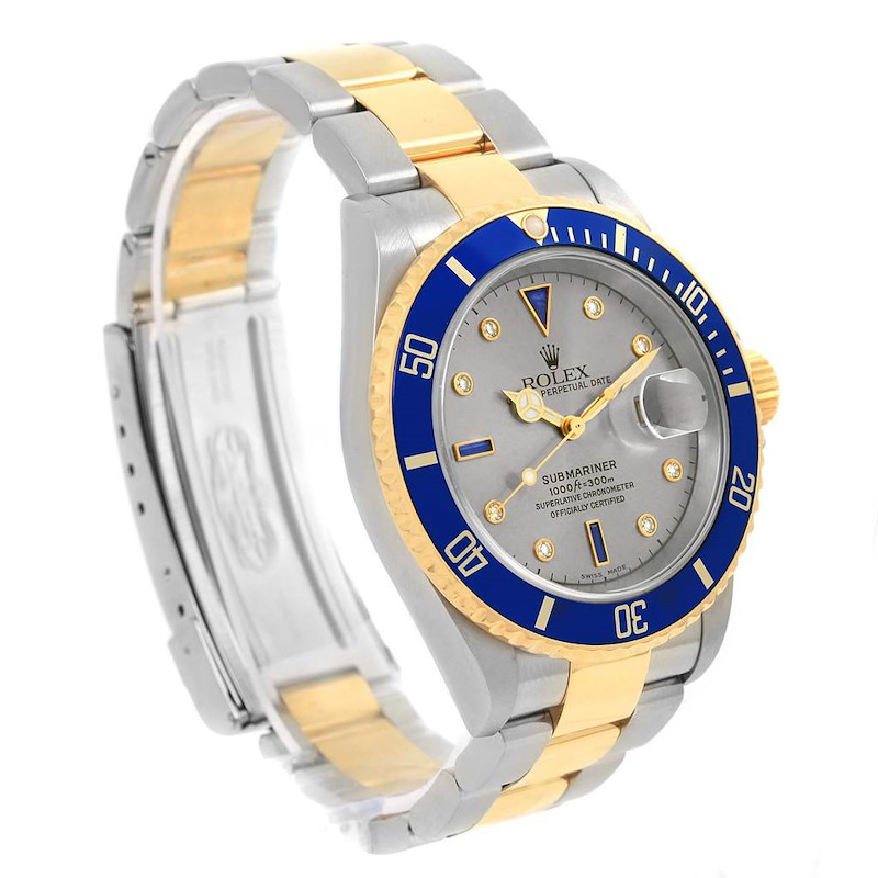 This image shows a side angle of the Rolex Submariner watch, highlighting its gold and silver bracelet and blue bezel.