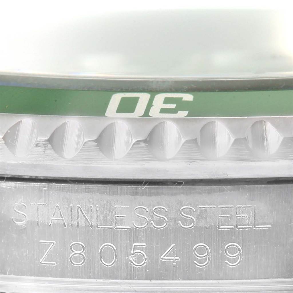This image shows a close-up of the bezel and part of the casing on a Rolex Submariner 16610LV Men's Stainless Steel Black Dial 16610LV Men's Stainless Steel Black Dial watch.