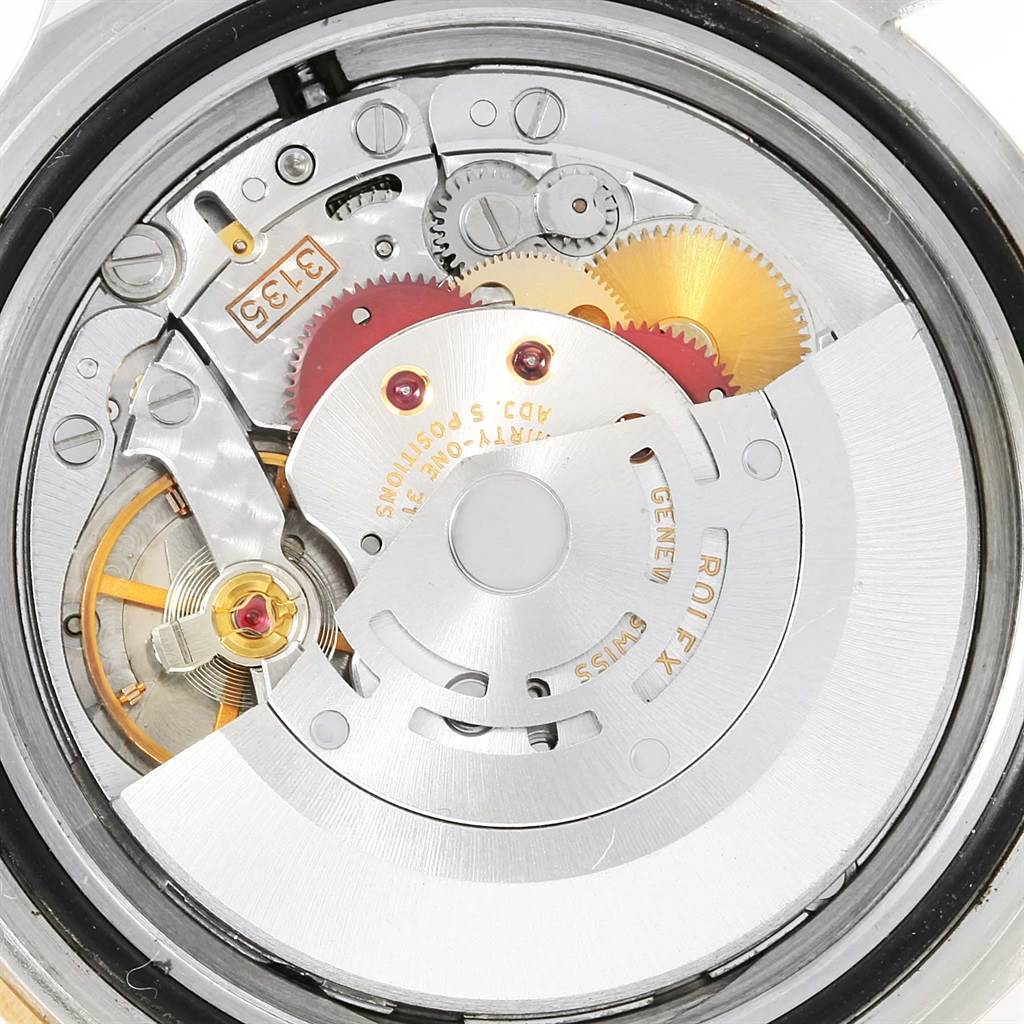 This image shows the internal mechanical movement of a Rolex Submariner 16613 Men
s Steel and Gold (two tone) Black Dial 16613 Men
s Steel and Gold (two tone) Black Dial watch, viewed from the rear with the case back removed.