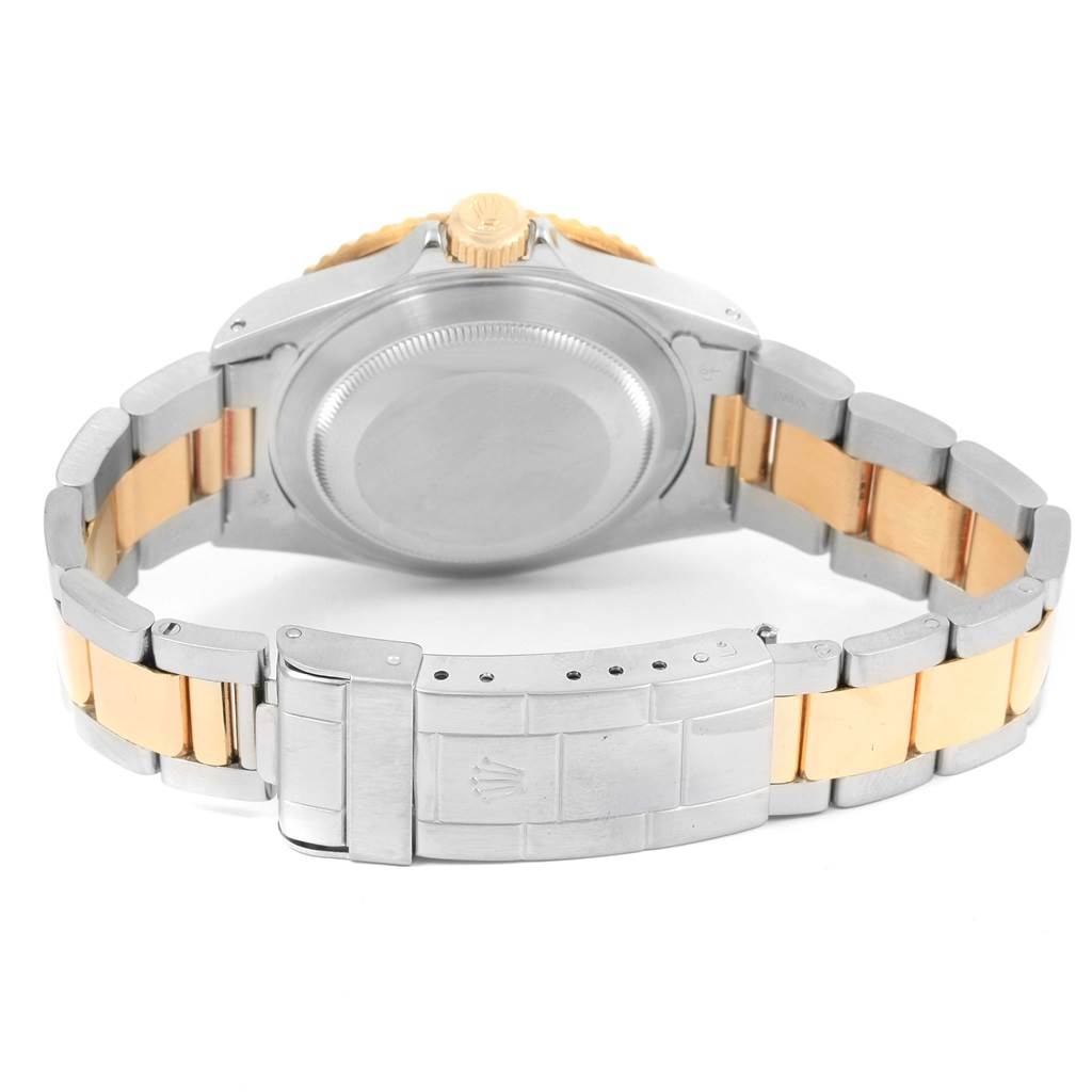 The image shows the back case and bracelet of a Rolex Submariner 16613 Men
s Steel and Gold (two tone) Black Dial 16613 Men
s Steel and Gold (two tone) Black Dial watch from a rear angle.