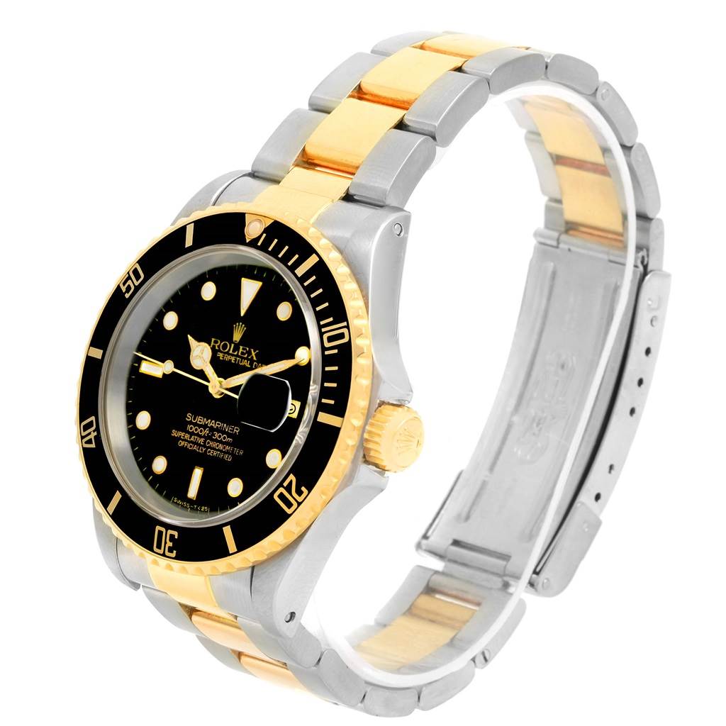The image shows a Rolex Submariner 16613 Men
s Steel and Gold (two tone) Black Dial 16613 Men
s Steel and Gold (two tone) Black Dial watch angled from the right side, displaying its bezel, dial, crown, and bracelet.