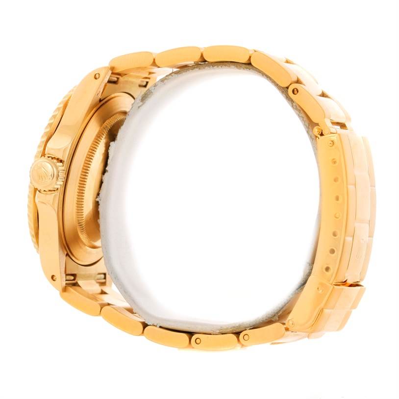 The image shows a side view of a Rolex Submariner 16618 Men's Yellow Gold Blue Dial 16618 Men's Yellow Gold Blue Dial watch focusing on the golden case and bracelet.