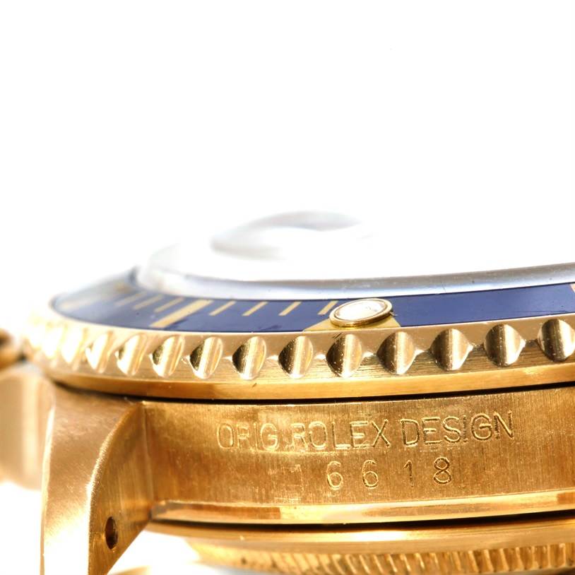 The image shows a close-up side view of the bezel and case with "ORIG. ROLEX DESIGN" engraving on a Rolex Submariner 16618 Men's Yellow Gold Blue Dial 16618 Men's Yellow Gold Blue Dial watch.