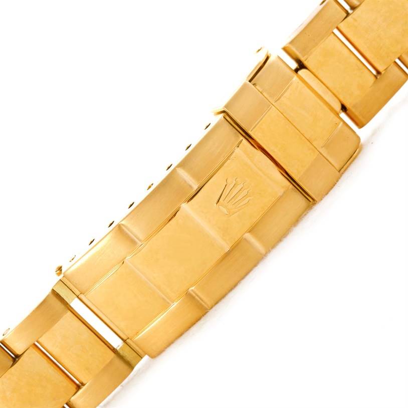 This image shows the gold bracelet clasp with the Rolex logo of a Rolex Submariner 16618 Men's Yellow Gold Blue Dial 16618 Men's Yellow Gold Blue Dial watch.