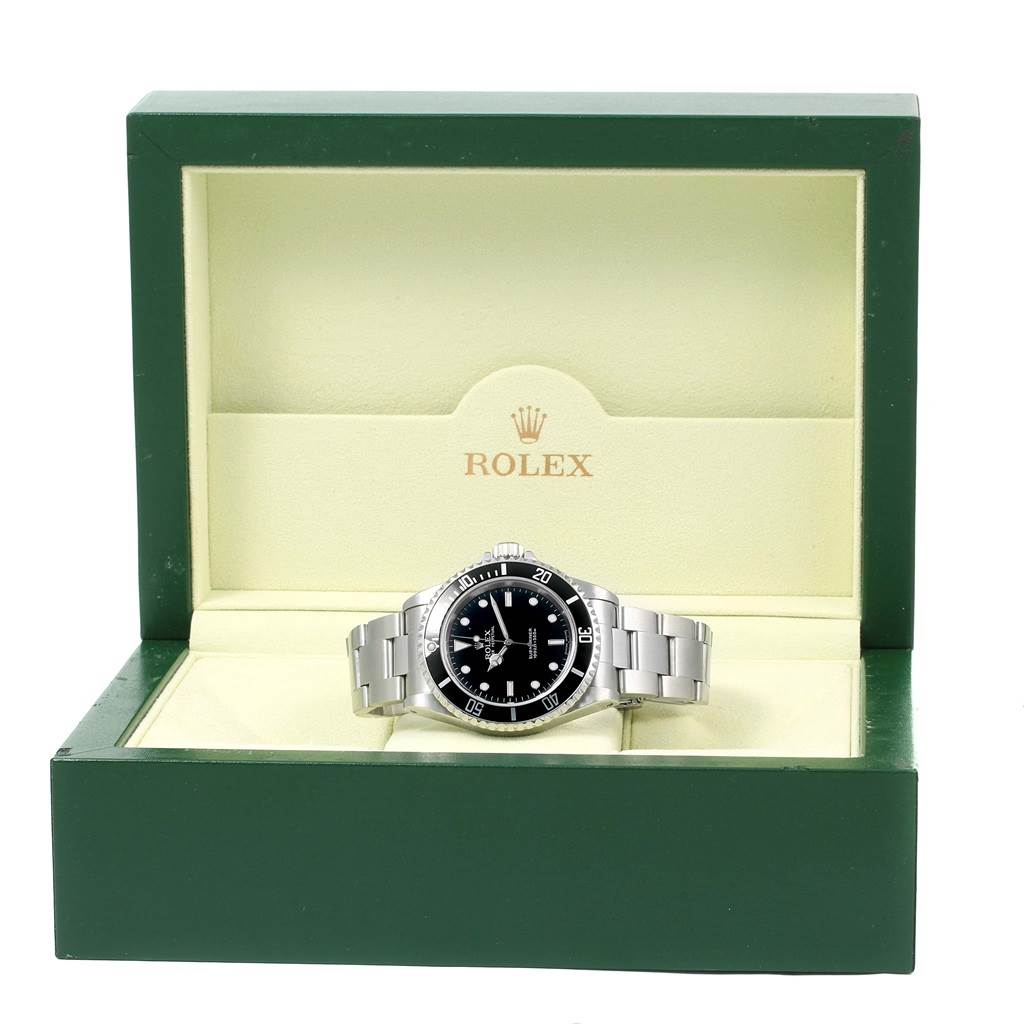 The Rolex Submariner 14060 Men's Stainless Steel Black Dial 14060 Men's Stainless Steel Black Dial watch is shown facing front, displayed in an open green box.