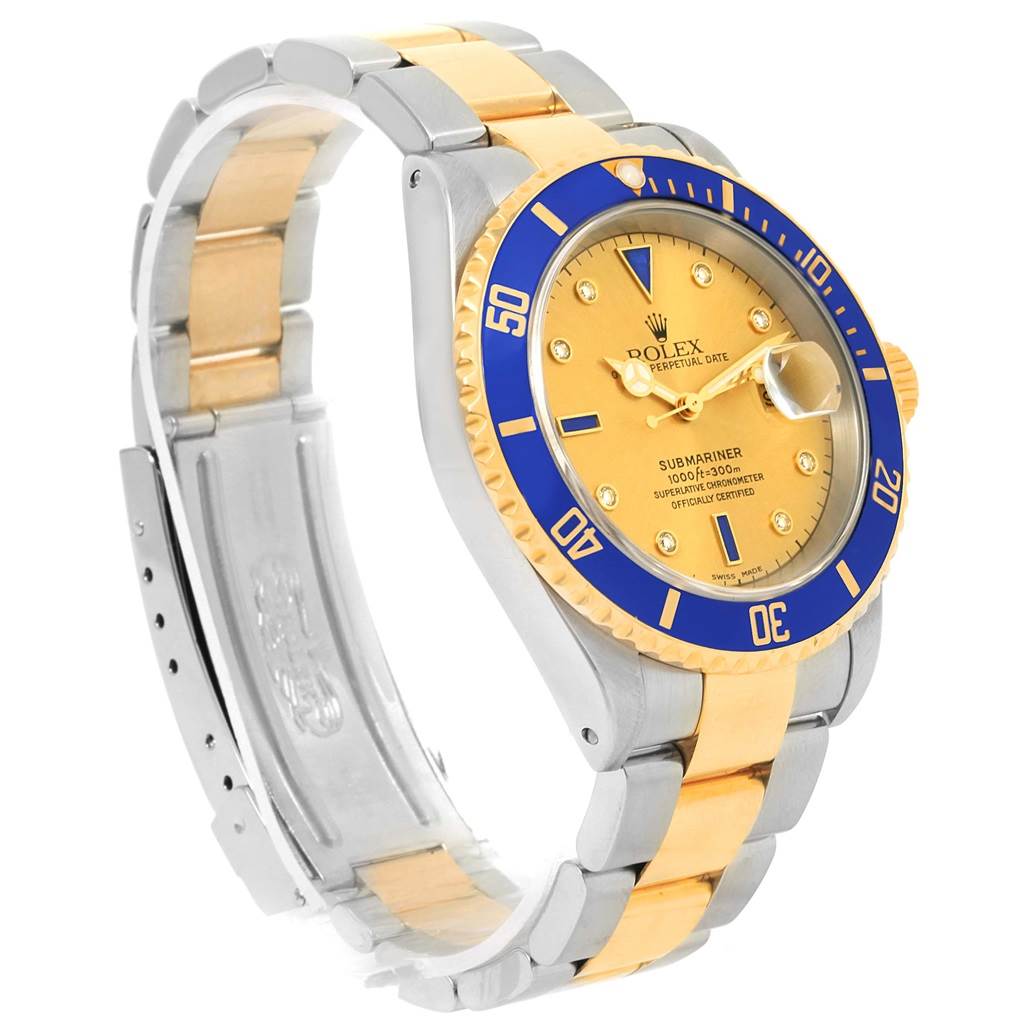 The image shows a side angle of a Rolex Submariner 16613 Men
s Steel and Gold (two tone) Champagne Dial 16613 Men
s Steel and Gold (two tone) Champagne Dial watch, highlighting the bracelet, bezel, and dial.