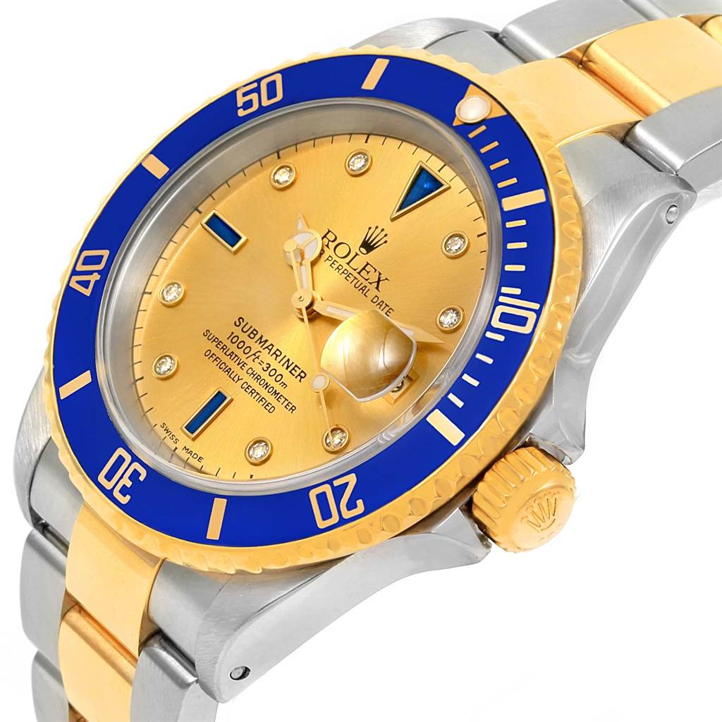 This image shows a close-up of the Rolex Submariner 16613 Men
s Steel and Gold (two tone) Champagne Dial 16613 Men
s Steel and Gold (two tone) Champagne Dial watch face, bezel, crown, and part of the two-tone bracelet.