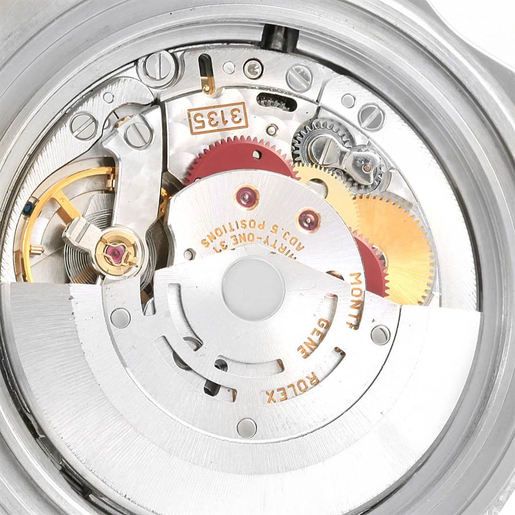 The image shows a close-up of the movement mechanism inside a Rolex Submariner 16610 Men's Stainless Steel Black Dial 16610 Men's Stainless Steel Black Dial watch.