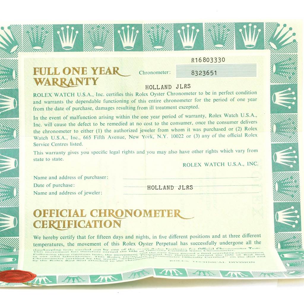 This image shows a flat lay of a Rolex Submariner 16803 Men
s Steel and Gold (two tone) Black Dial 16803 Men
s Steel and Gold (two tone) Black Dial
s official chronometer certification and warranty card.