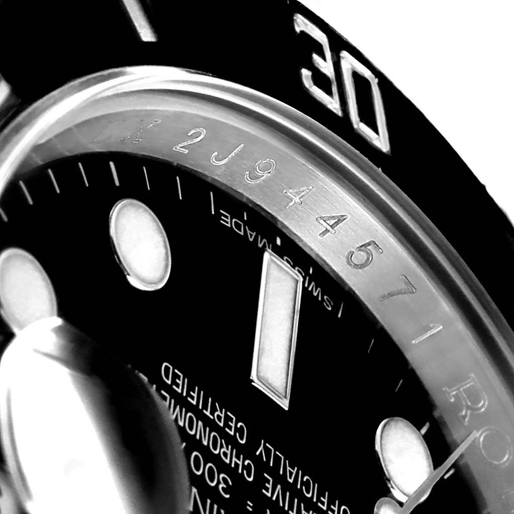 The image shows a close-up of the dial and bezel, including part of the serial number, of a Rolex Submariner 116610 Men's Stainless Steel Black Dial 116610 Men's Stainless Steel Black Dial watch.