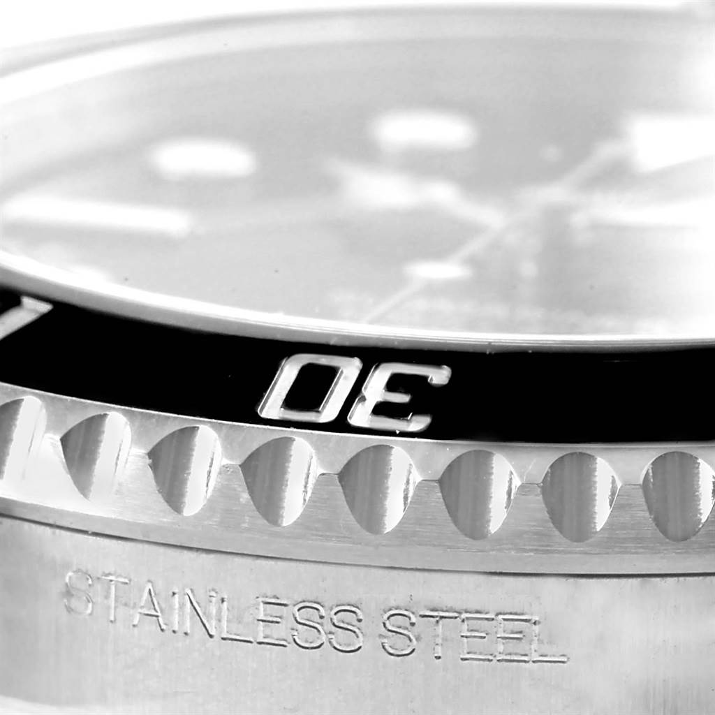 This close-up image shows the stainless steel bezel and part of the dial on the Rolex Submariner 116610 Men's Stainless Steel Black Dial 116610 Men's Stainless Steel Black Dial watch.