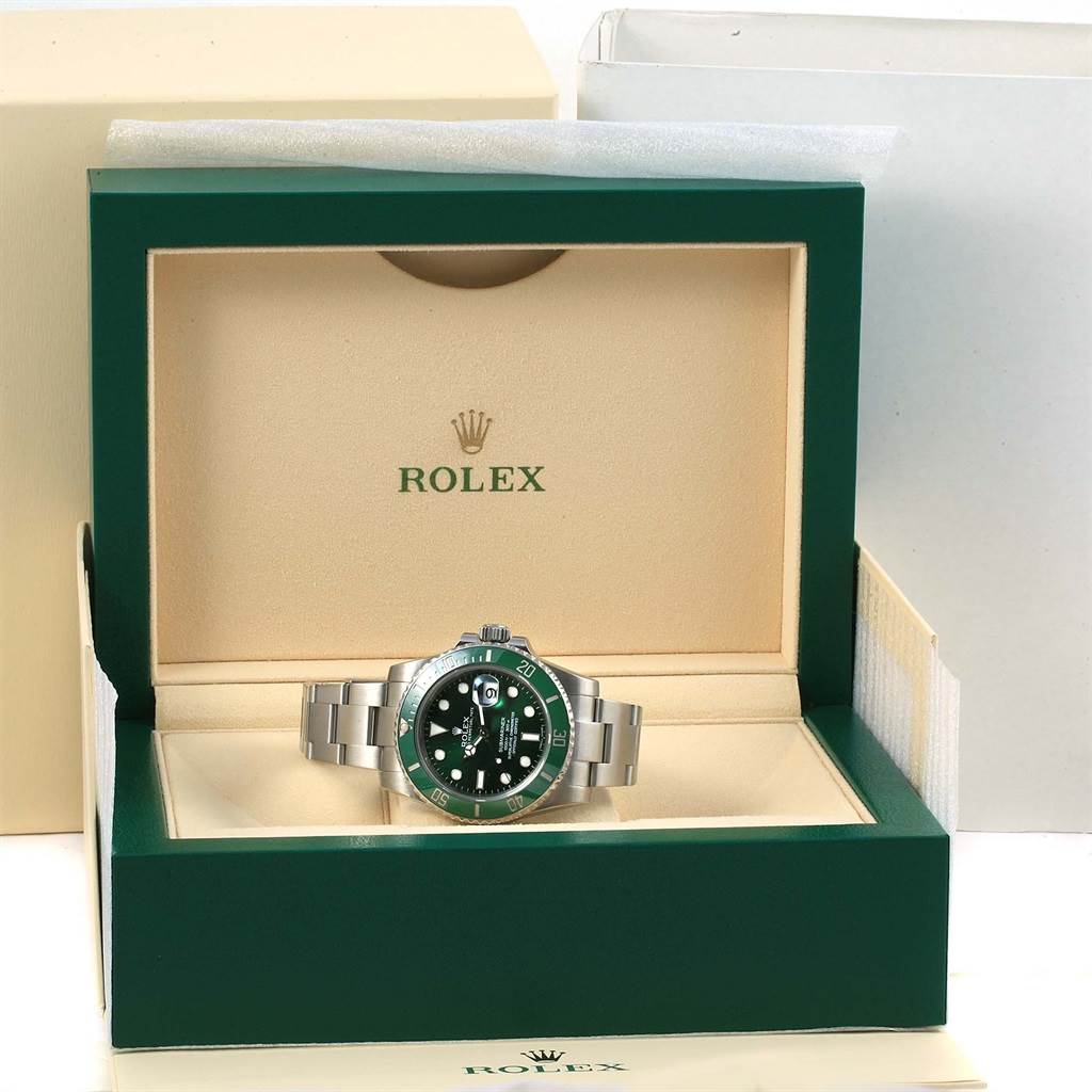 The Rolex Submariner 116610LV Men's Stainless Steel Green Dial 116610LV Men's Stainless Steel Green Dial watch is shown front-facing in its green and beige presentation box.