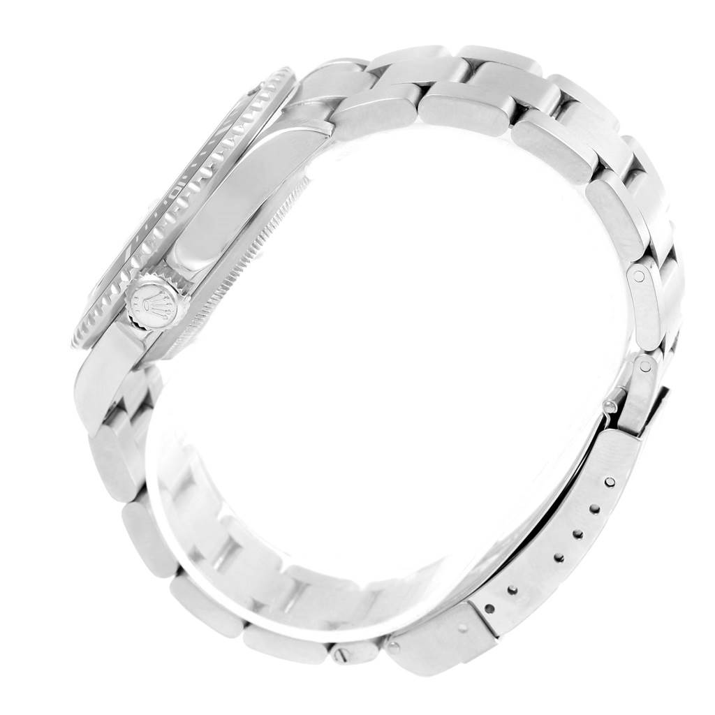 The image shows a side view of a Rolex Submariner 16610 Men's Stainless Steel Black Dial 16610 Men's Stainless Steel Black Dial watch, highlighting its case, bezel, crown, and metal bracelet.