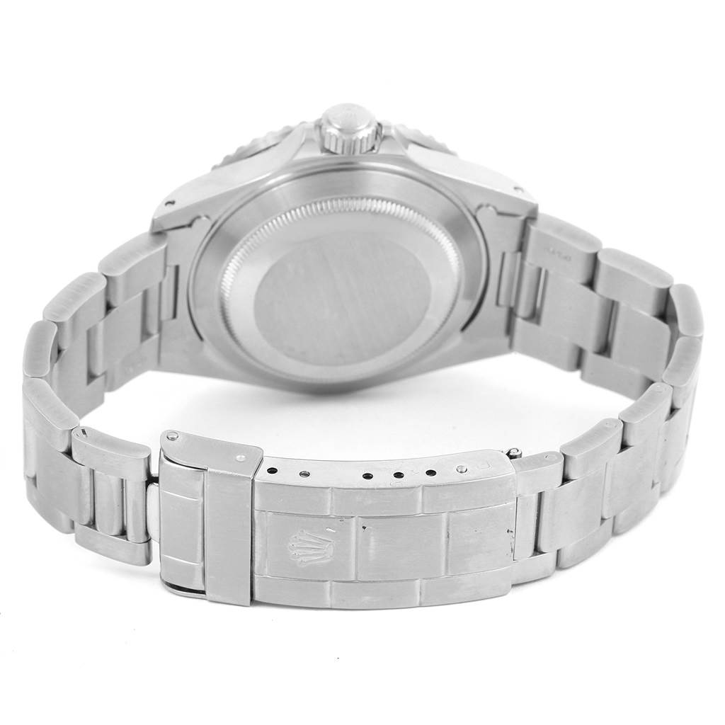 The image shows the back view of a Rolex Submariner 16610 Men's Stainless Steel Black Dial 16610 Men's Stainless Steel Black Dial watch, displaying its case back, bracelet, and clasp.