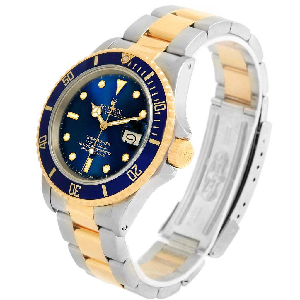 The image shows a side-angle view of a Rolex Submariner 16803 Men's Steel and Gold (two tone) Blue Dial 16803 Men's Steel and Gold (two tone) Blue Dial watch, displaying the face, bezel, crown, and bicolor bracelet.