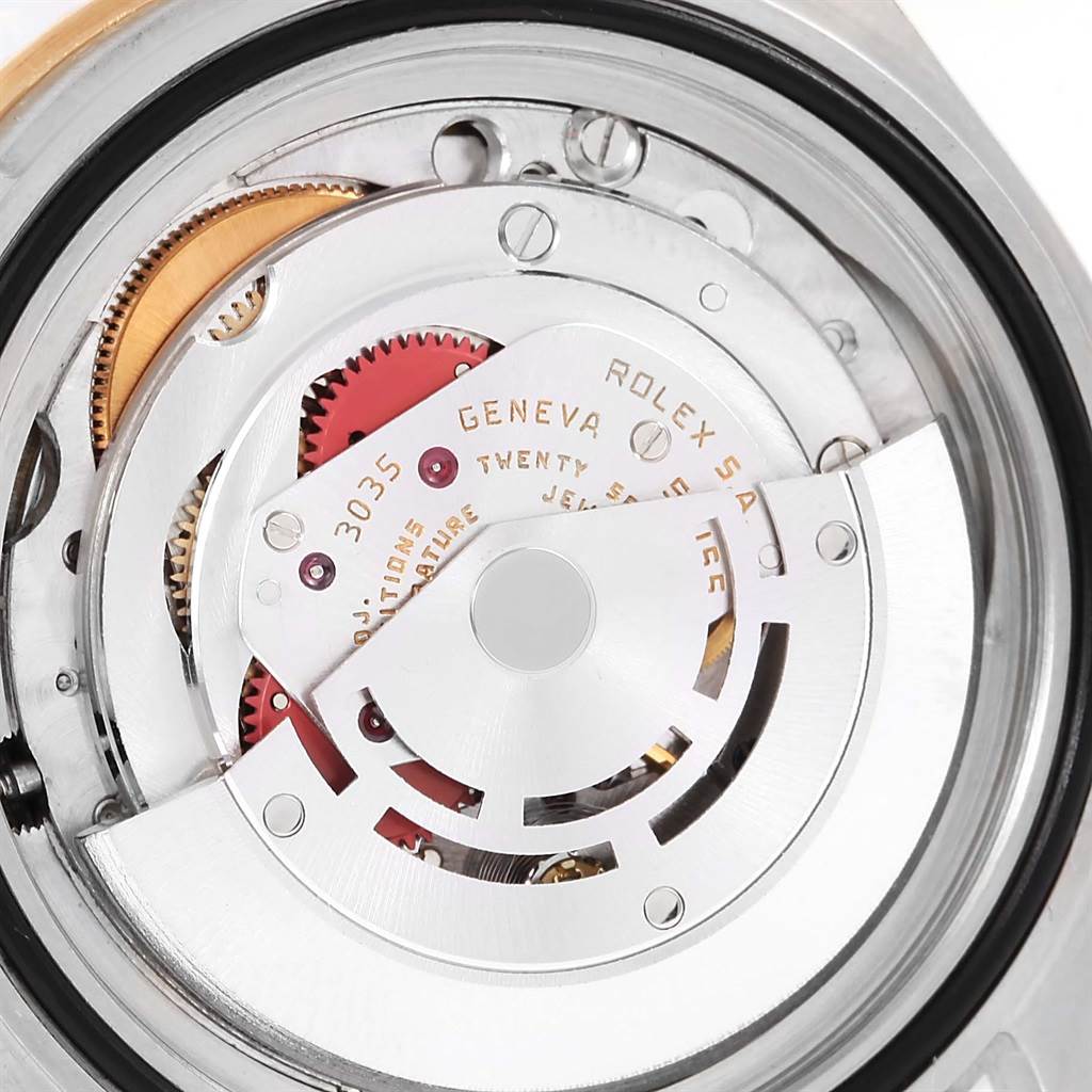 The image shows the internal movement mechanism of a Rolex Submariner 16803 Men's Steel and Gold (two tone) Blue Dial 16803 Men's Steel and Gold (two tone) Blue Dial watch from a close-up, top-down angle.