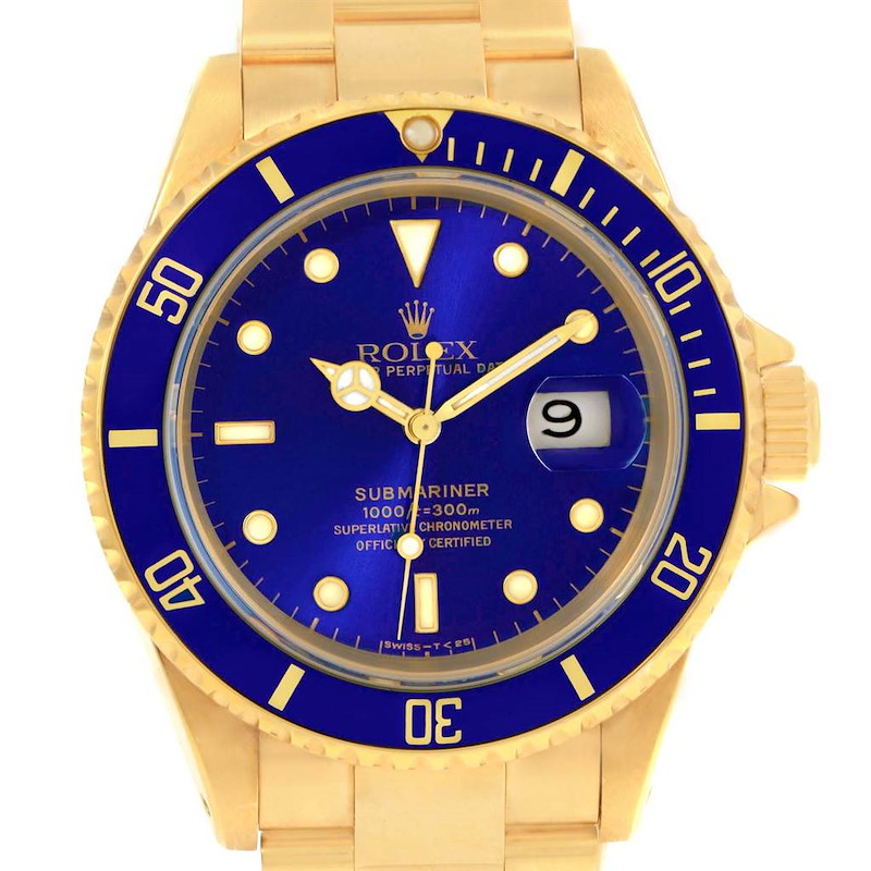 The image shows a front view of a Rolex Submariner watch with a blue dial and bezel, gold case, and bracelet.