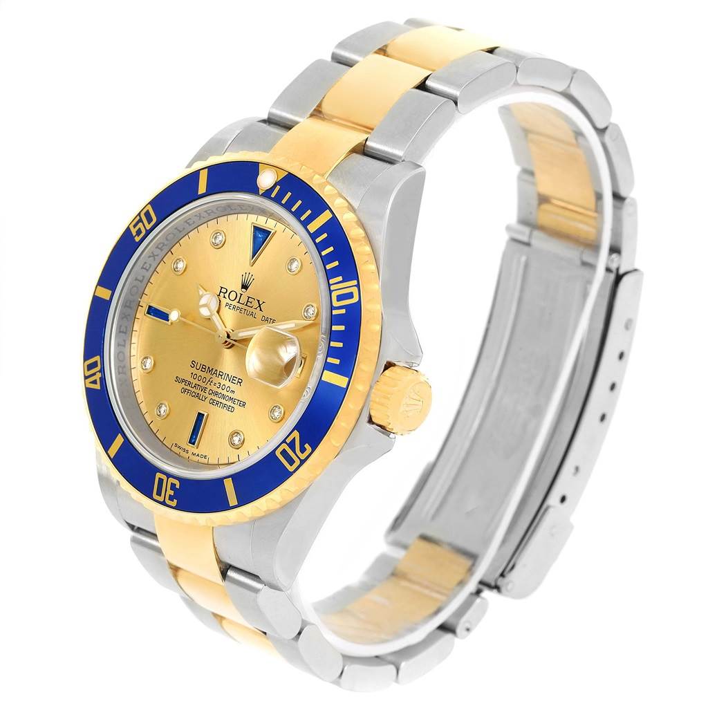 This image shows a Rolex Submariner 16613 Men's Steel and Gold (two tone) Champagne Dial 16613 Men's Steel and Gold (two tone) Champagne Dial watch at a three-quarter angle, highlighting its gold and blue bezel, bracelet, and crown.