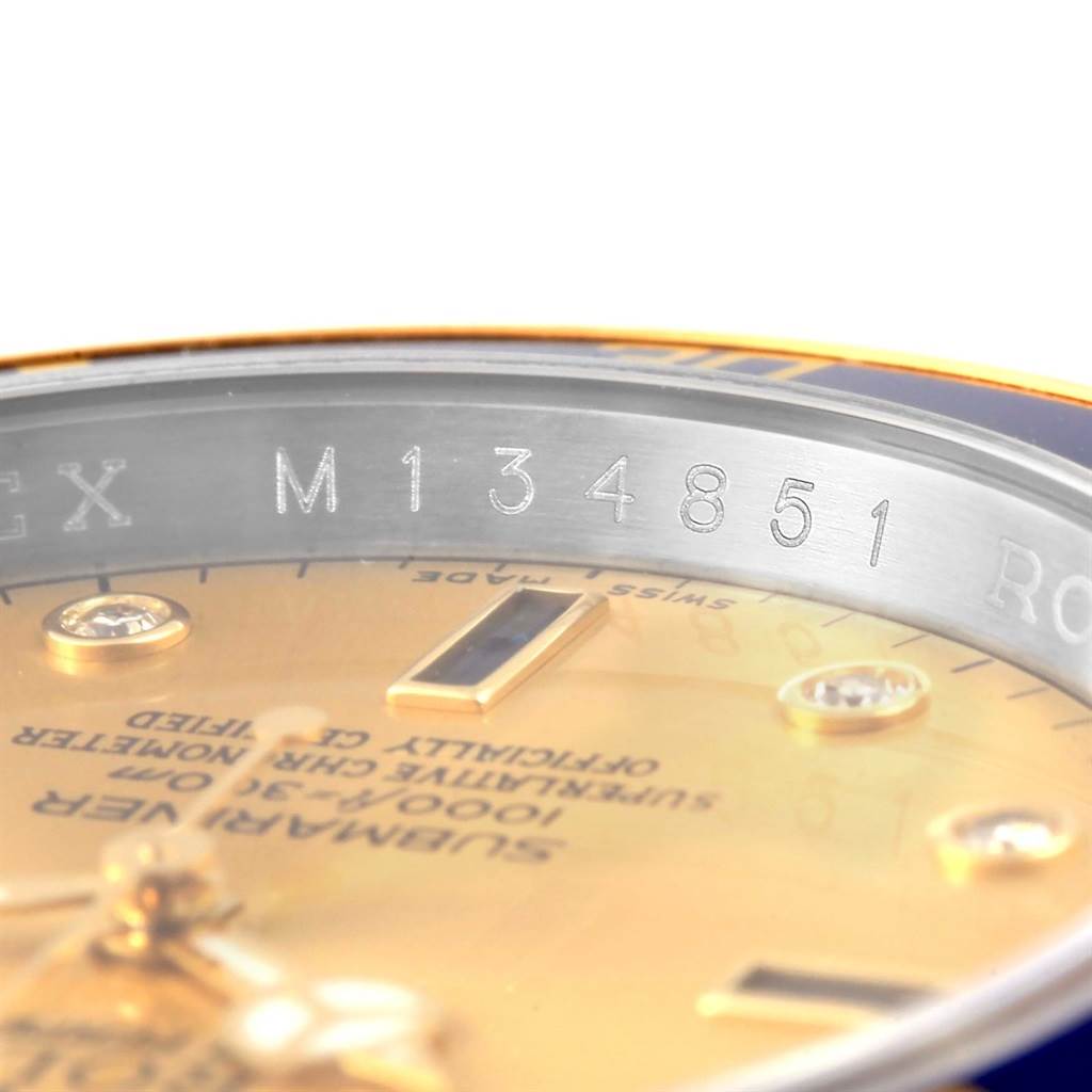 This close-up image shows the serial number engraved on the rehaut of a Rolex Submariner 16613 Men's Steel and Gold (two tone) Champagne Dial 16613 Men's Steel and Gold (two tone) Champagne Dial watch.